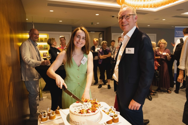 Sophie McShera and John David cutting the celebration cake