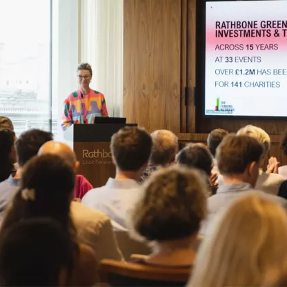 Picture of event room with crowd and speaker 